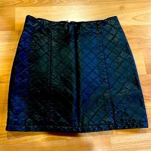 Faux leather quilted mini skirt.